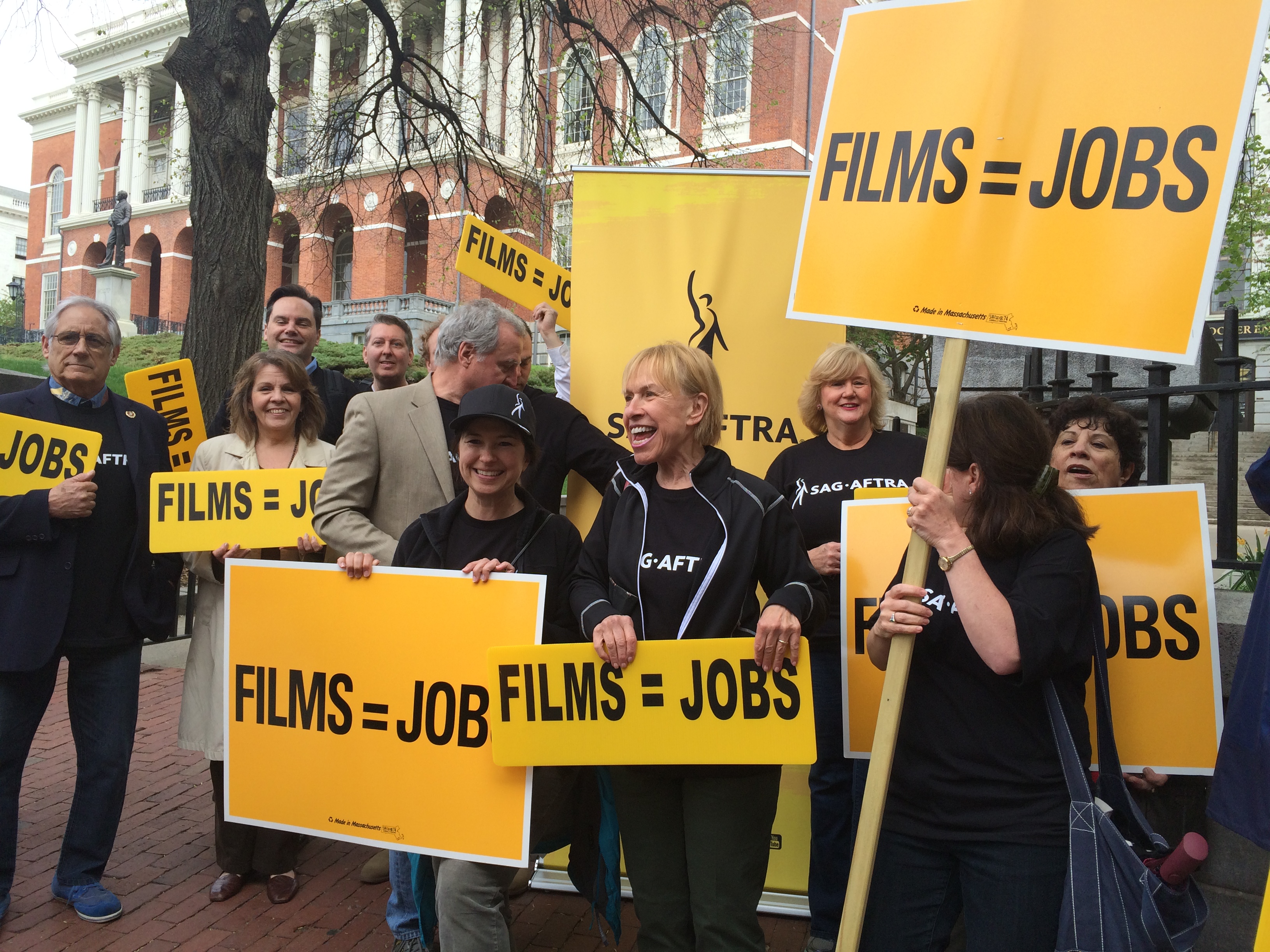 : New England local president Michele Proude with local secretary Ellen Colton surrounded by #SAGAFTRAmembers.