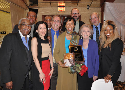 Fellow members and staff join Alma Washington to celebrate.