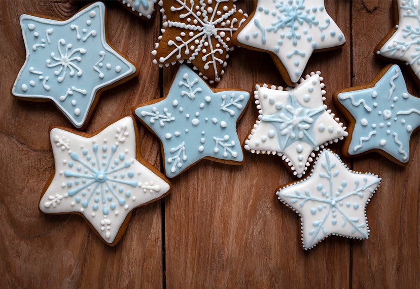 blue and white star cookies that look like snowflakes