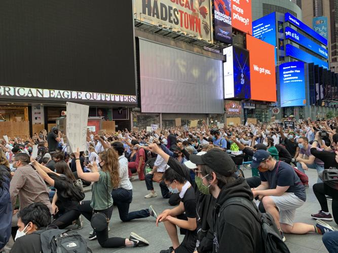 Taking a knee in Times Square. Brandenjames.com photo.