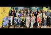 A few dozen members pose for a photo, some sitting, some standing. A woman in a wheelchair is one the left, under the SAG-AFTRA logo.