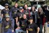 A group photo of men and women of different ethnicities wearing black "SAG-AFTRA Strong" shirts.