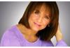 Valerie Harper in a lilac top with a grey background